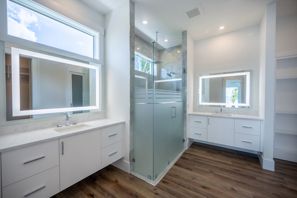 "Contemporary bathroom cabinetry by Amish artisans with a stylish white finish."